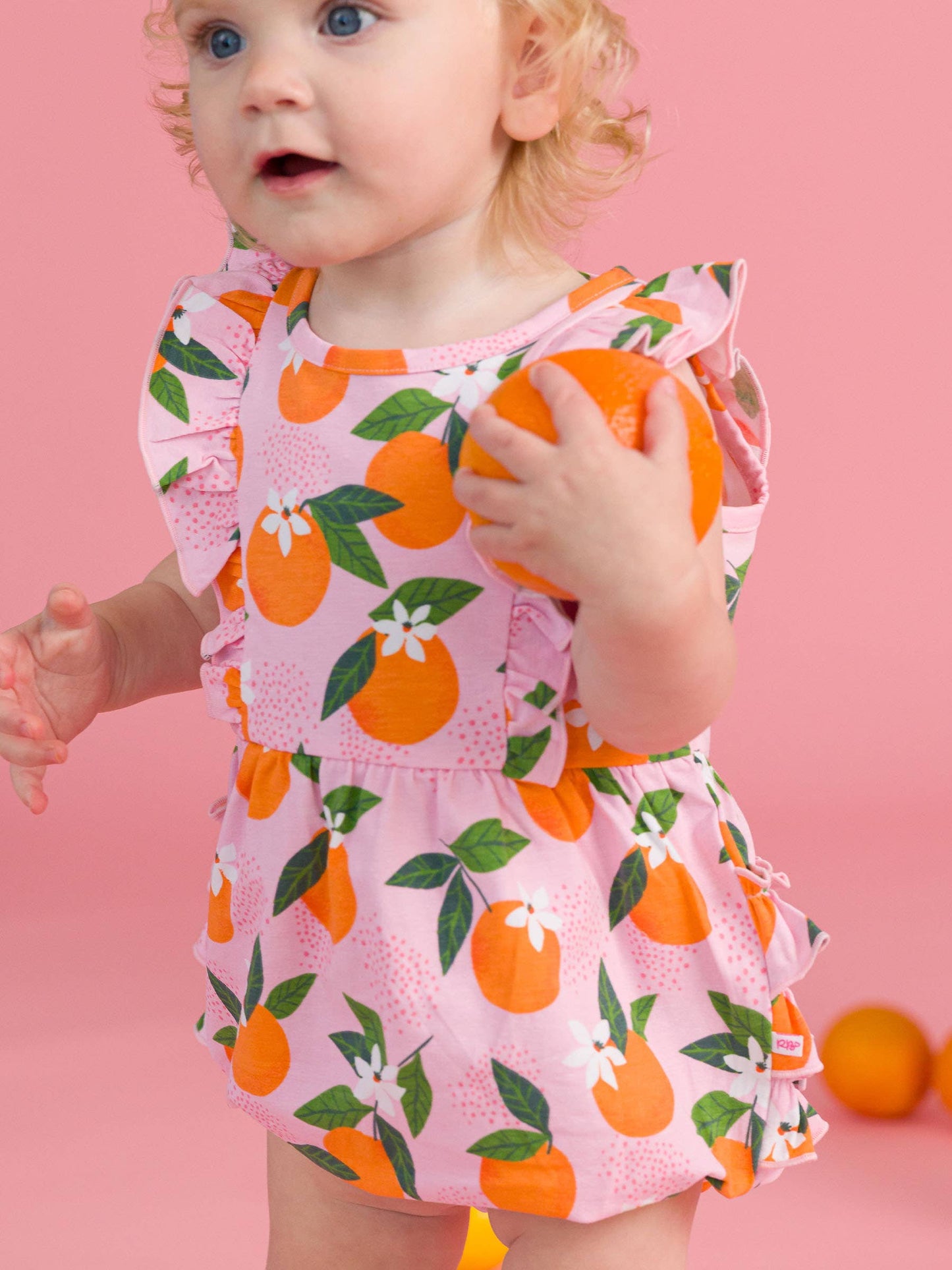 Baby Girls Orange You The Sweetest Sleeveless Waterfall Bubble Romper with Signature Rear Ruffles